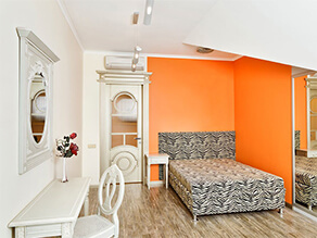 Art Deco Bedroom With Orange Feature Wall